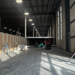 System 40™ modular wall installation in progress inside a large industrial building